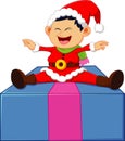 Little santa sitting on gift box