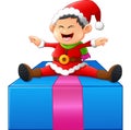 Little santa sitting on gift box