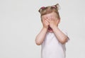 Little scared or crying or playing bo-peep girl hiding face Royalty Free Stock Photo