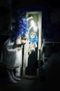 Little scary blue hair girl with lantern