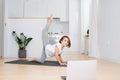 Little school age girl doing gymnastics at home in isolation Royalty Free Stock Photo