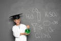 Little school child in laboratory uniform with flask Royalty Free Stock Photo