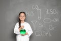 Little school child in laboratory uniform with flask Royalty Free Stock Photo