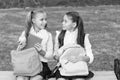 Little school friends girls with backpacks, school break concept Royalty Free Stock Photo