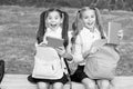 Little school friends girls with backpacks, sincere happiness concept Royalty Free Stock Photo