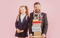 Little school girl and fether teacher with hold a books with school bag is back to school, empty space in studio Royalty Free Stock Photo