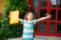 Little school student rejoices to the termination of academic year.