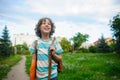 Little schoolboy comes back from school in good mood. Royalty Free Stock Photo