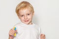 Little schoolboy on a light background