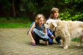 Little schoolchildren met on the way to school a large dog.