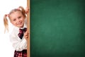 Little Schoolgirl Peeking Behind The Blackboard