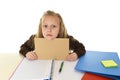 Little schoolgirl sad tired and bored holding paper with blank copy space for adding text Royalty Free Stock Photo