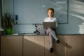 little schoolgirl using laptop on table at classroom Royalty Free Stock Photo