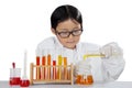 Little scientist experimenting chemical liquid