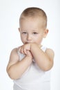 Little shy boy on white background Royalty Free Stock Photo