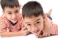 Little siblings boy brother smiling laying down together with happy face Royalty Free Stock Photo