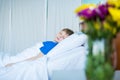 Little sick boy sleeping in hospital bed Royalty Free Stock Photo