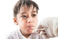 Little sick boy with temperature in mouth by doctor hand on white background