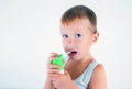 Little sick boy used medical spray for breath. little boy using his asthma pump. Use a spray for allergies. Cute baby enjoys the Royalty Free Stock Photo