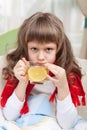 Little sick girl in bed is taking medicine Royalty Free Stock Photo