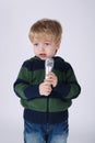 Little singing boy with mic Royalty Free Stock Photo