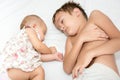 Little sister and brother sleeping in bed at home Royalty Free Stock Photo