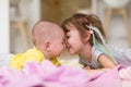 Little sister and her baby brother playing at home Royalty Free Stock Photo