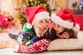 Little sister tells winter story to her brother. Children dreaming about christmas gifts Royalty Free Stock Photo