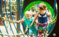 Little sisters at action-oriented playground Royalty Free Stock Photo