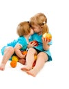 Little sisters with fruit Royalty Free Stock Photo