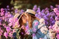 Little sisters outdoor portrait in a pink meadow