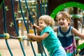 Little sisters at playground in park Royalty Free Stock Photo