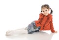The little sitting girl isolated on a white