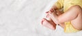 little six month old baby belly and legs lying on white bed. top view, copy space Royalty Free Stock Photo