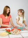 Little six year old girl joyful enthusiasm helps mum