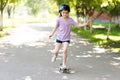 Little skates on one leg. In a helmet.