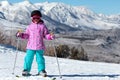 Little Skier girl on a mountain ski