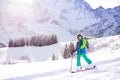 Little skier portrait: boy over mountain ski slope Royalty Free Stock Photo