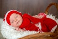 Little sleeping newborn baby boy, wearing Santa hat Royalty Free Stock Photo