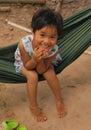 Little smiling asian girl swing in hammock