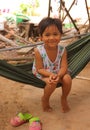 Little smiling asian girl swing in hammock