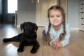 Little smiling baby kid and puppy Labrador retriever Royalty Free Stock Photo