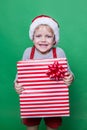 Little smiling Boy holding present box. Christmas concept Royalty Free Stock Photo