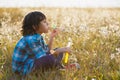 Little smiling boy playing soap bubbles in summer park outdoor Royalty Free Stock Photo