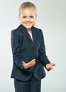 Child girl in business suit. Smiling schoolgirl. Royalty Free Stock Photo