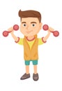 Little smiling caucasian boy holding dumbbells.