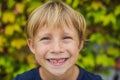 Little smiling child boy hand pointing his first baby milk or temporary tooth fall out Royalty Free Stock Photo