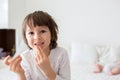 Little smiling child boy hand pointing his first baby milk tooth fall out Royalty Free Stock Photo