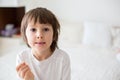 Little smiling child boy hand pointing his first baby milk tooth Royalty Free Stock Photo