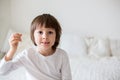 Little smiling child boy hand pointing his first baby milk tooth Royalty Free Stock Photo